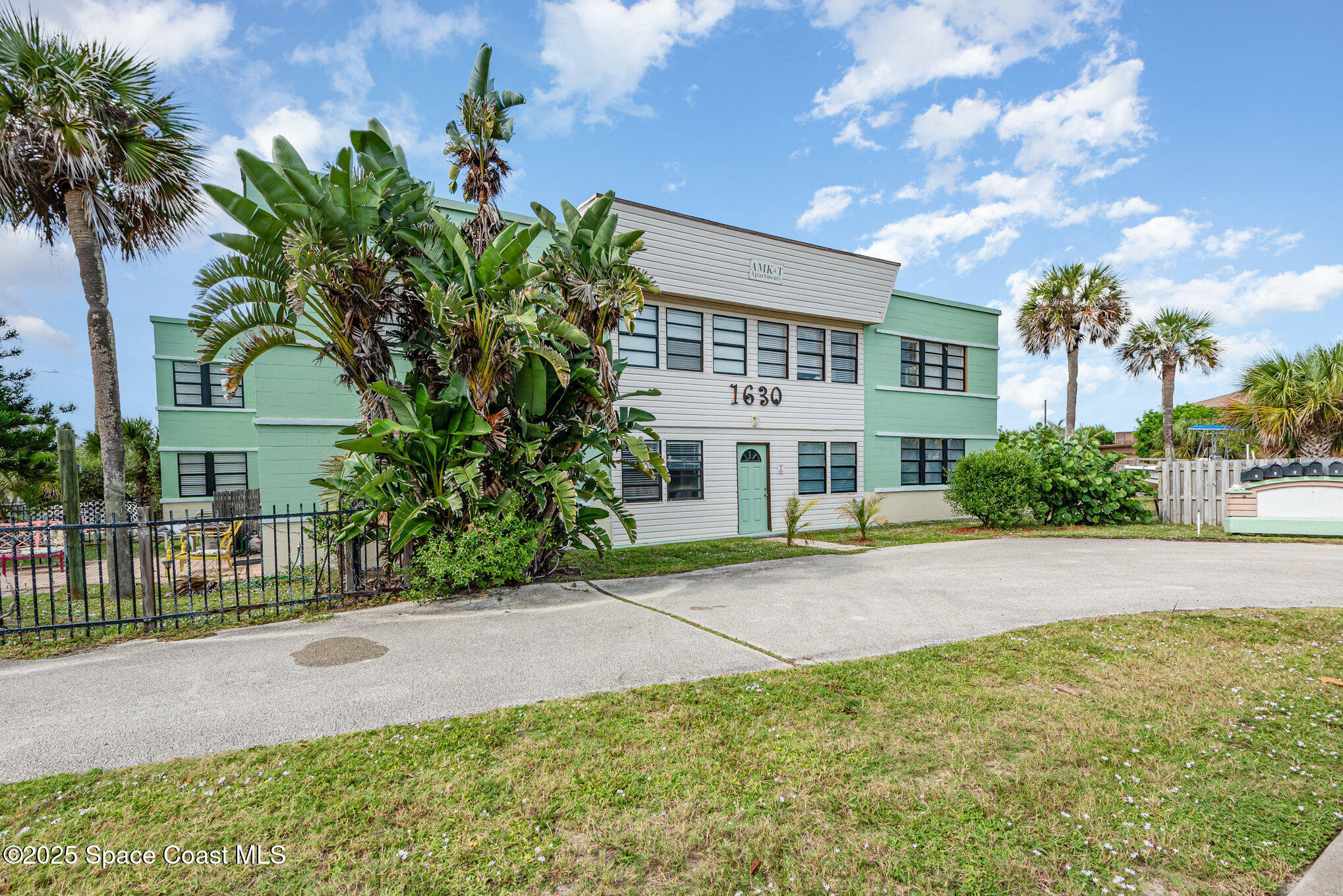 Undisclosed Address Cocoa Beach, FL 32931 - Photo 8 of 20 a view of a house with a yard and potted plants