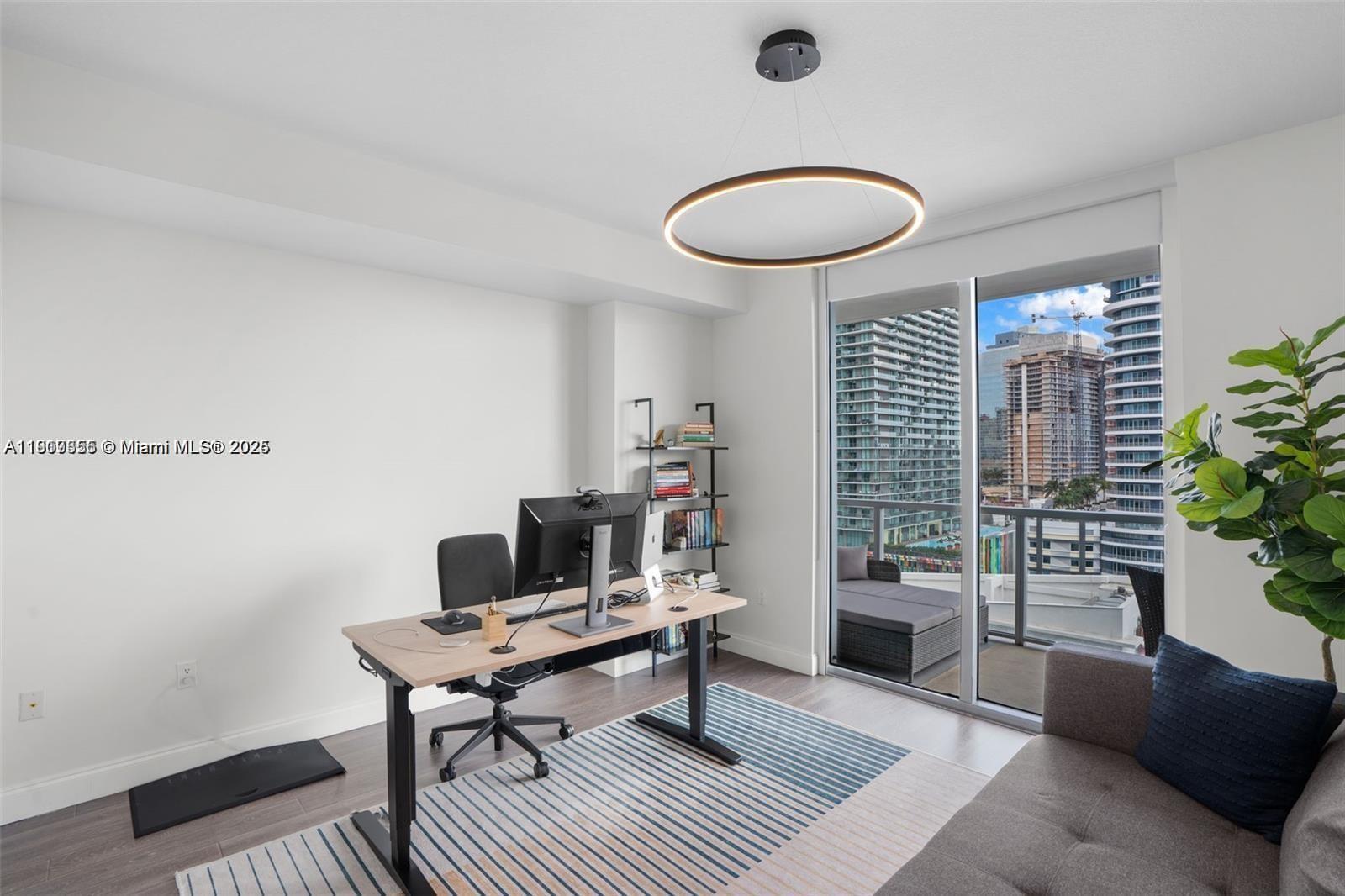 79 Southwest 12th Street, Unit 2204S Miami, FL 33130 - Photo 17 of 27 a living room with furniture and a potted plant