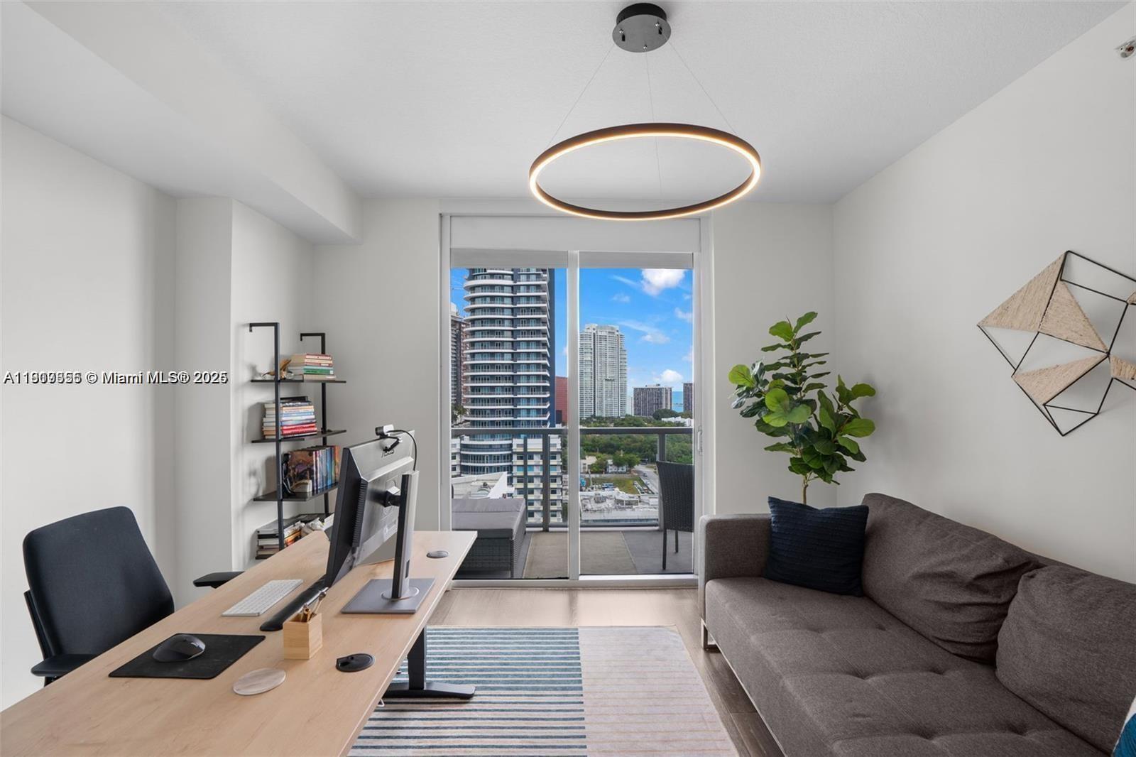 79 Southwest 12th Street, Unit 2204S Miami, FL 33130 - Photo 19 of 27 a living room with furniture