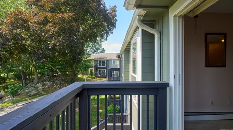 a view of a brick house with a large window