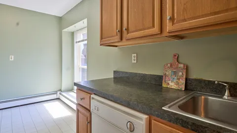 a kitchen with granite countertop a sink and a granite counter tops