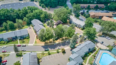 an aerial view of house with yard swimming pool and outdoor seating