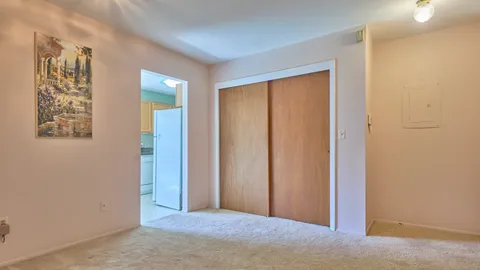 a view of a hallway with closet area