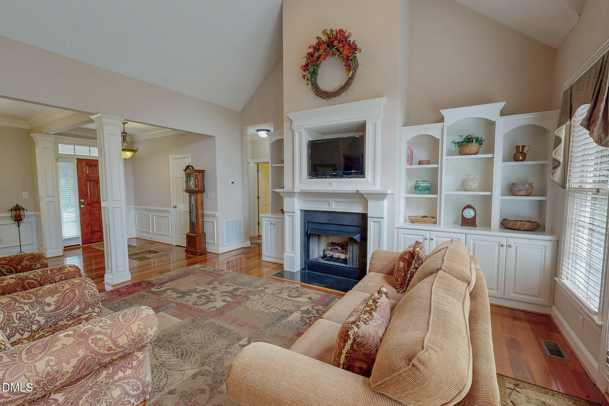 115 Duncan Plantation Road Timberlake, NC 27583 - Photo 4 of 48 a living room with furniture and a fireplace