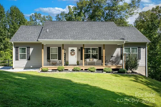 a front view of house with a garden and patio
