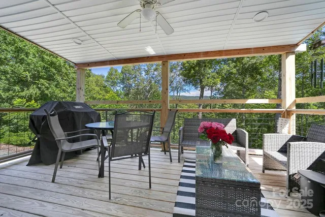 a view of a patio with chairs and wooden floor
