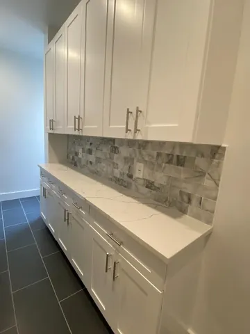 a view of cabinets and wooden floor