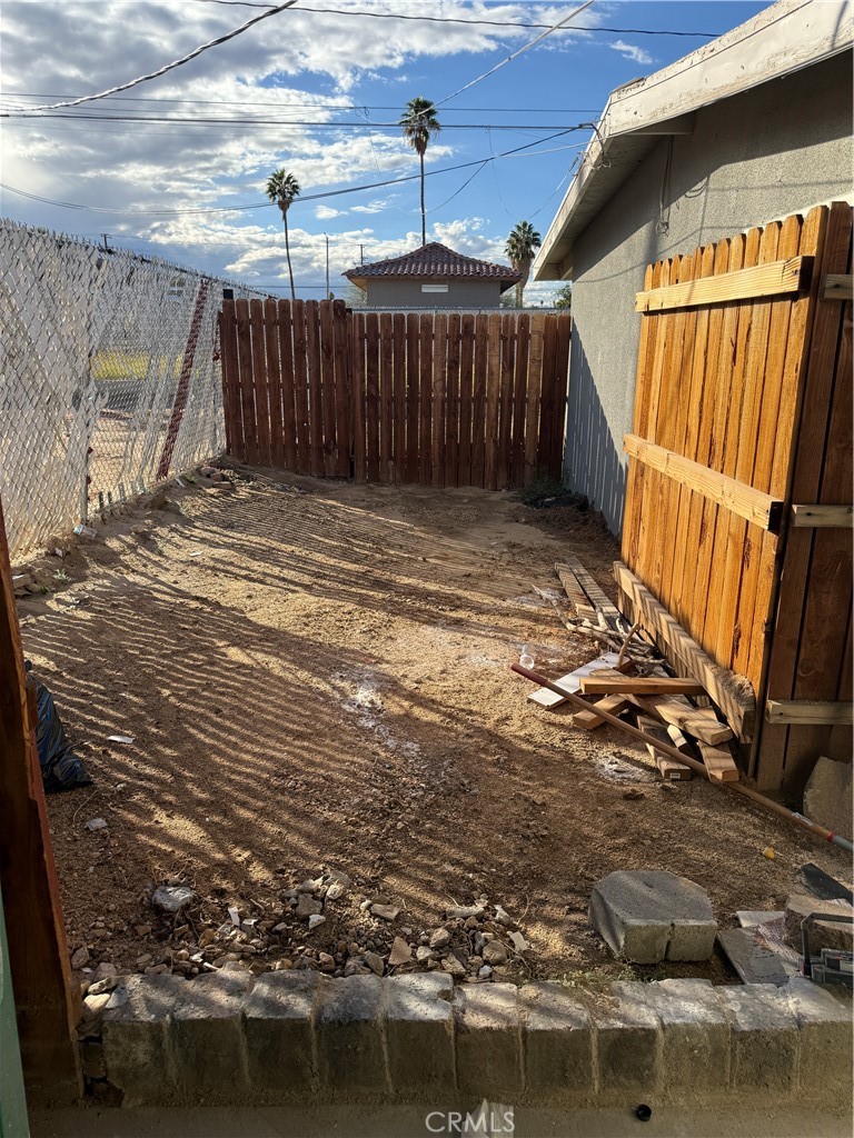 6030 Ocotillo Avenue Twentynine Palms, CA 92277 - Photo 9 of 10 a view of a backyard of the house