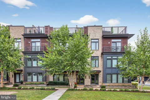 a front view of a building with garden
