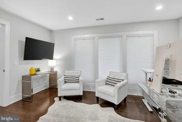 a bathroom with a granite countertop toilet sink and a mirror