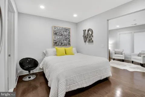 a kitchen with kitchen island a counter space a sink appliances and cabinets