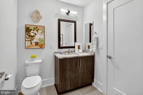 a kitchen with stainless steel appliances kitchen island granite countertop a sink stove and cabinets