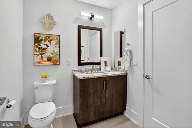 a kitchen with stainless steel appliances kitchen island granite countertop a sink stove and cabinets