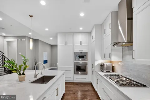 a view of dinning table and chairs in a room