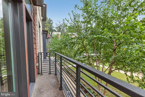 a bedroom with a bed and a table