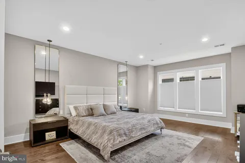 a bedroom with a bed and a tv on table