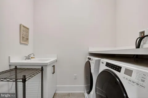 a view of an empty room with a cabinet