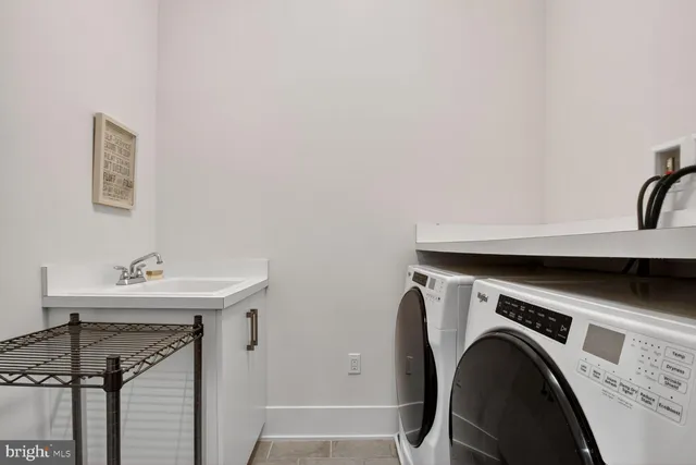 a view of an empty room with a cabinet