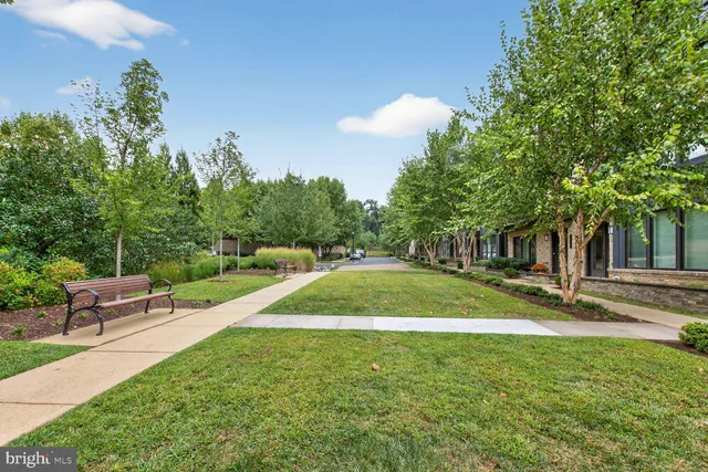 a view of entryway with furniture and wooden floor