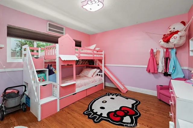 a bed room with a bed and a chair