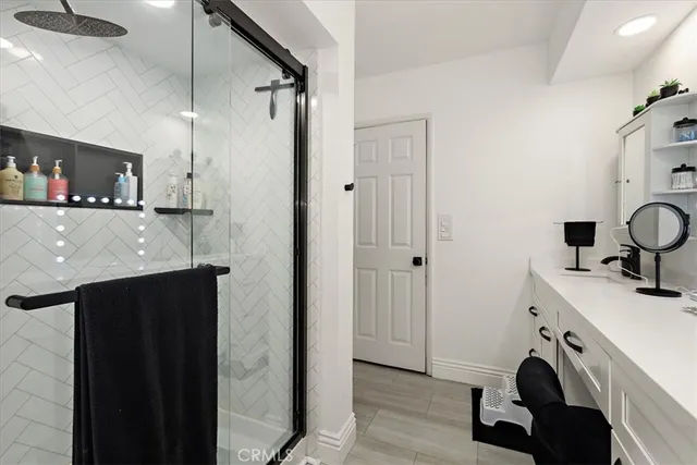 a view of a kitchen with a sink and a refrigerator