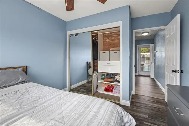 a bedroom with bed and walk in closet