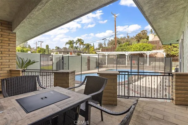 a view of a balcony with dining area