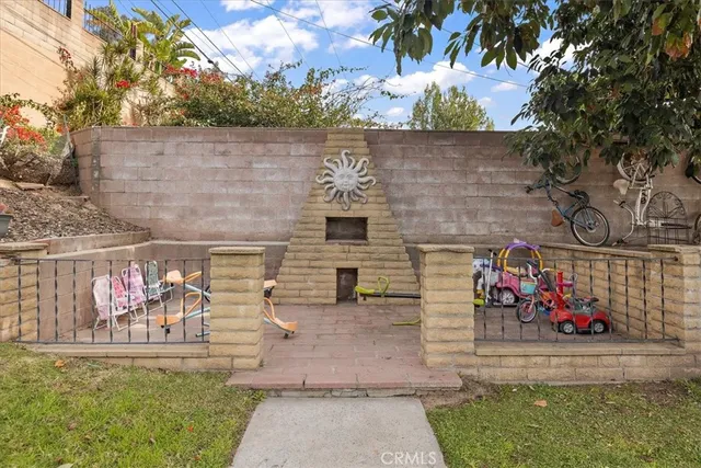 a room with wooden floor pool table and windows