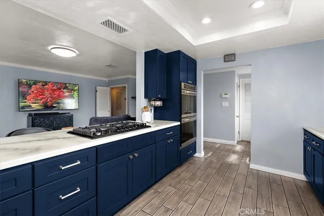 a kitchen with wooden cabinets and a sink