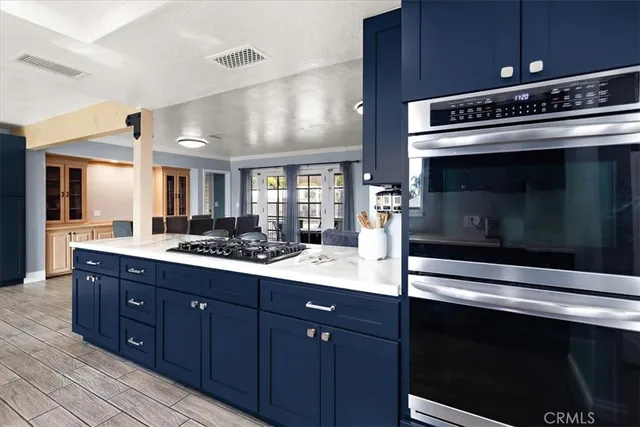 a kitchen with a stove and a microwave