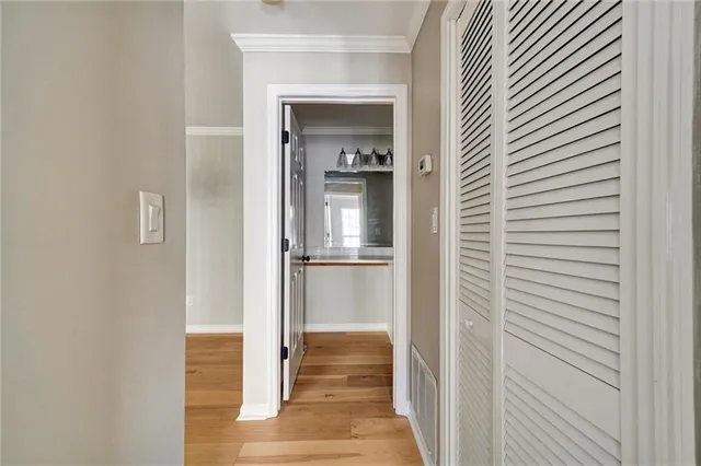 a view of a room with wooden floor