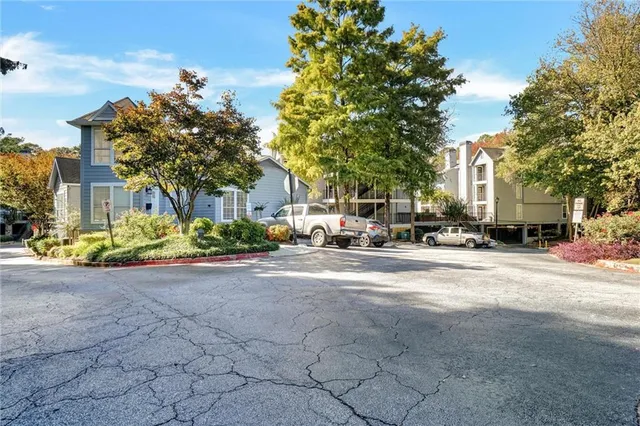 a view of a city street lined with buildings and trees