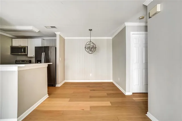 a view of a kitchen with a sink dishwasher and a microwave oven