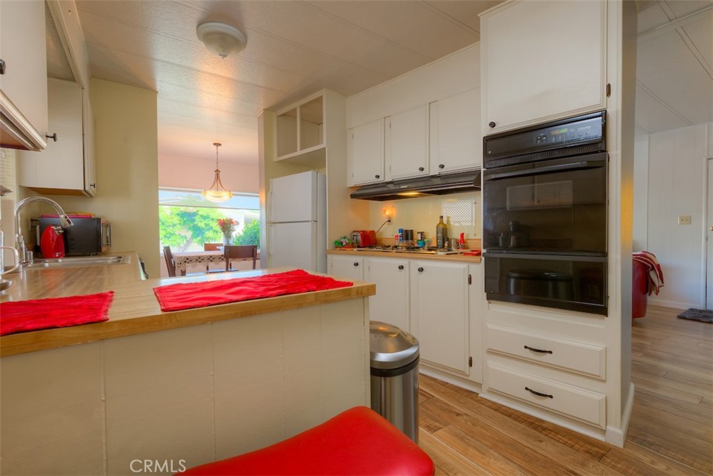 1901 Dayton Road, Unit 133 Chico, CA 95928 - Photo 13 of 36 a kitchen with cabinets and appliances