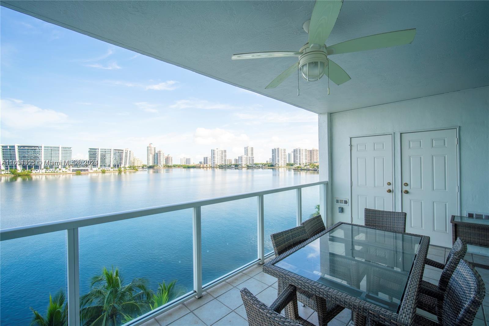 18100 North Bay Road, Unit 606 Sunny Isles Beach, FL 33160 - Photo 23 of 30 a view of a lake from a balcony