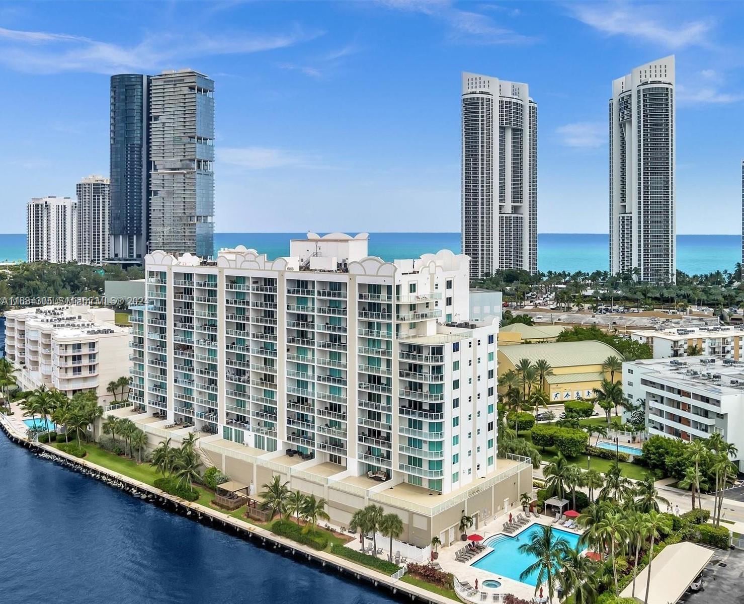18100 North Bay Road, Unit 606 Sunny Isles Beach, FL 33160 - Photo 28 of 30 a front view of a building with glass windows