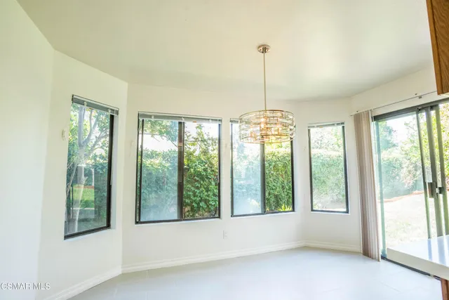 a view of entryway and kitchen