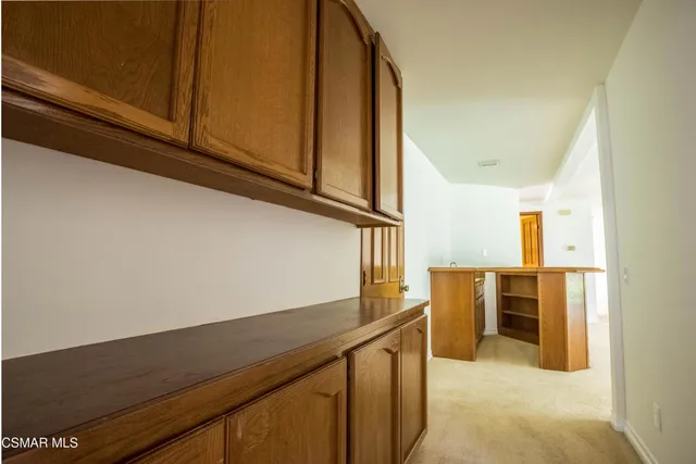 a view of a hallway with granite countertop a sink