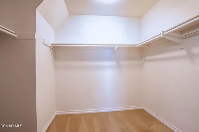 a bathroom with a bathtub and next to a window
