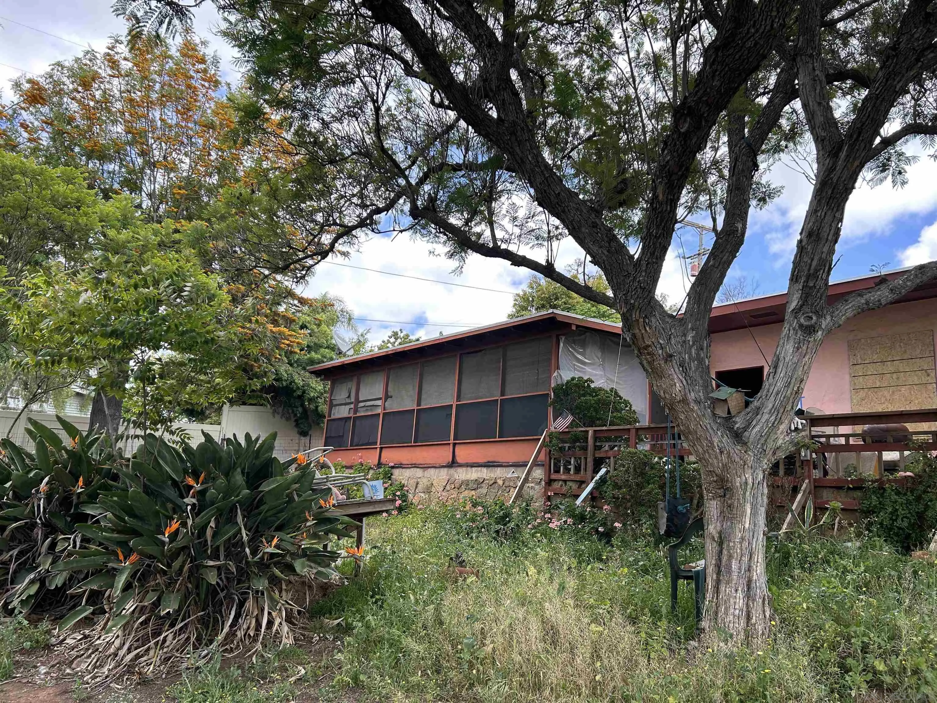 5025 Crestland Drive La Mesa, CA 91941 - Photo 3 of 19 a backyard of a house with lots of green space