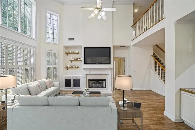 a living room with fireplace furniture and a flat screen tv