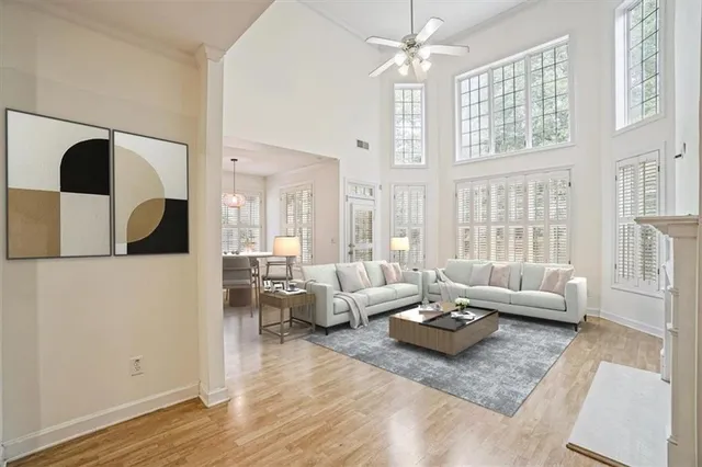 a living room with furniture and wooden floor