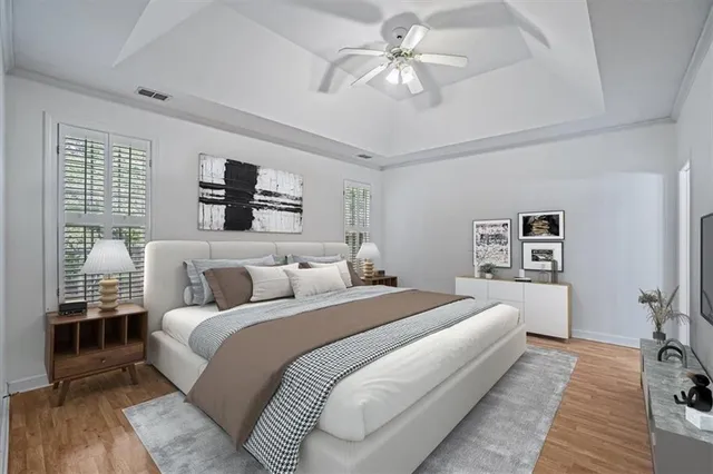 a bedroom with a large bed and a window