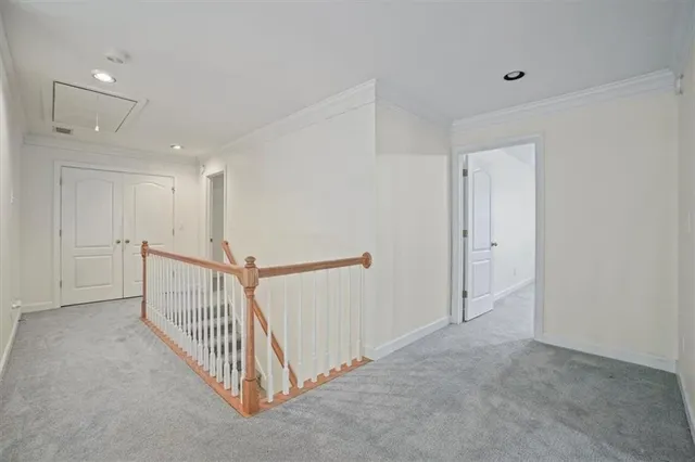 a view of a hallway with stairs