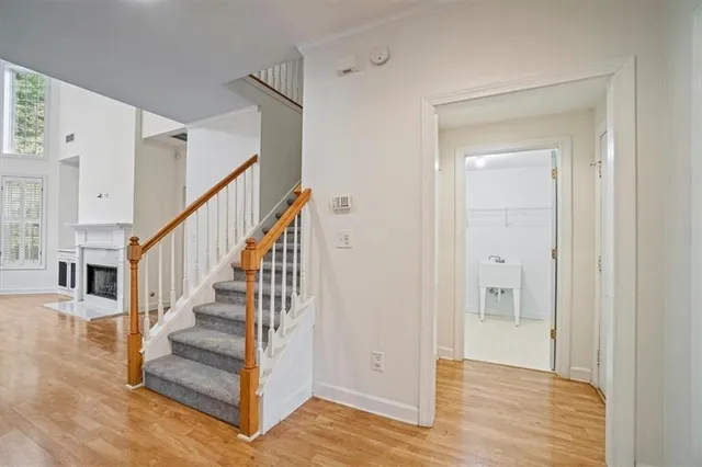 a view of entryway and hall with wooden floor