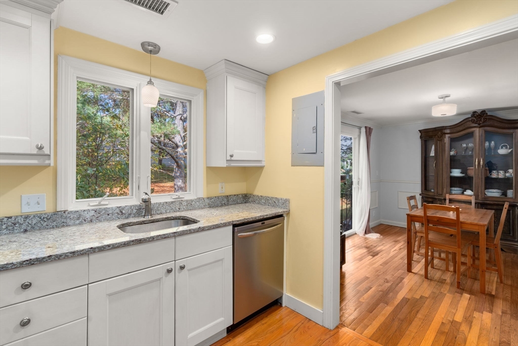 8 Jericho Road, Unit 8 Weston, MA 02493 - Photo 11 of 19 a kitchen with granite countertop a sink and wooden floor