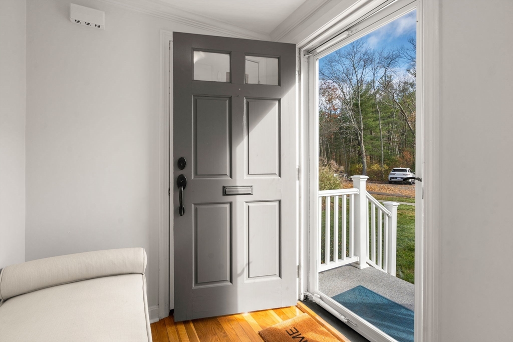 8 Jericho Road, Unit 8 Weston, MA 02493 - Photo 3 of 19 a view of a door and chair in a room