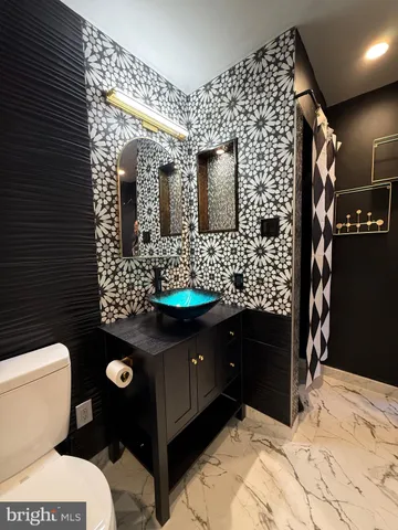 a bathroom with a sink and a shower