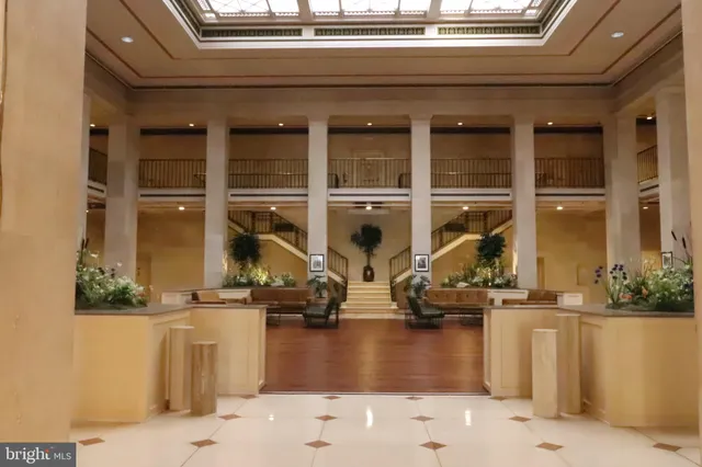 a lobby with glass windows and painted walls