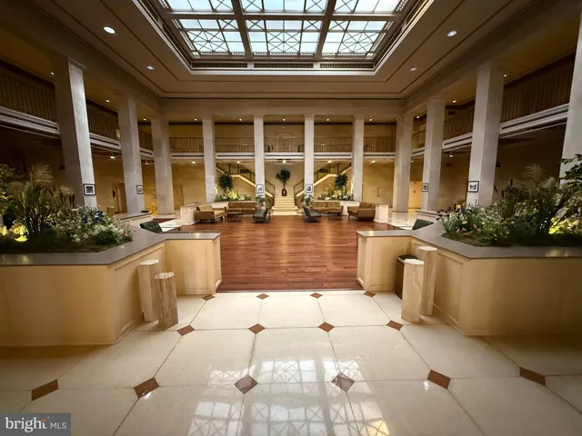 a view of living room with furniture and floor to ceiling windows